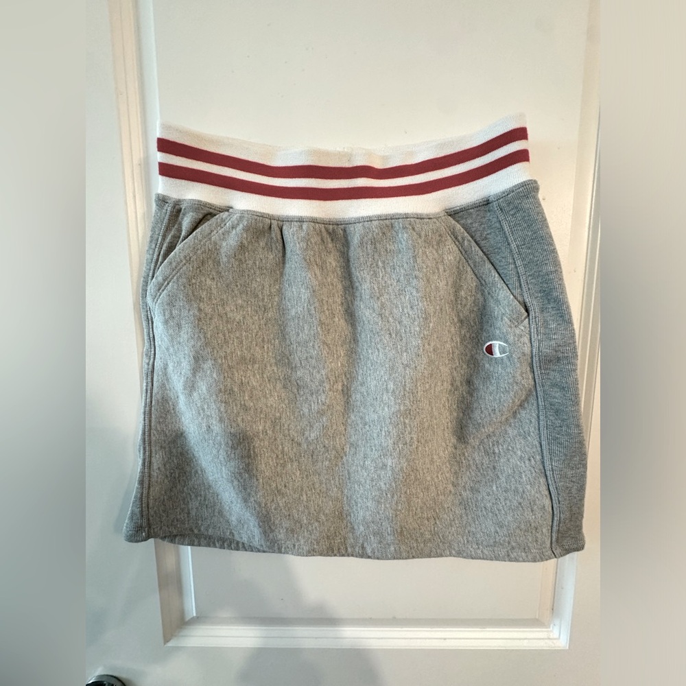 Champion grey mini skirt with red and white band. Size large.